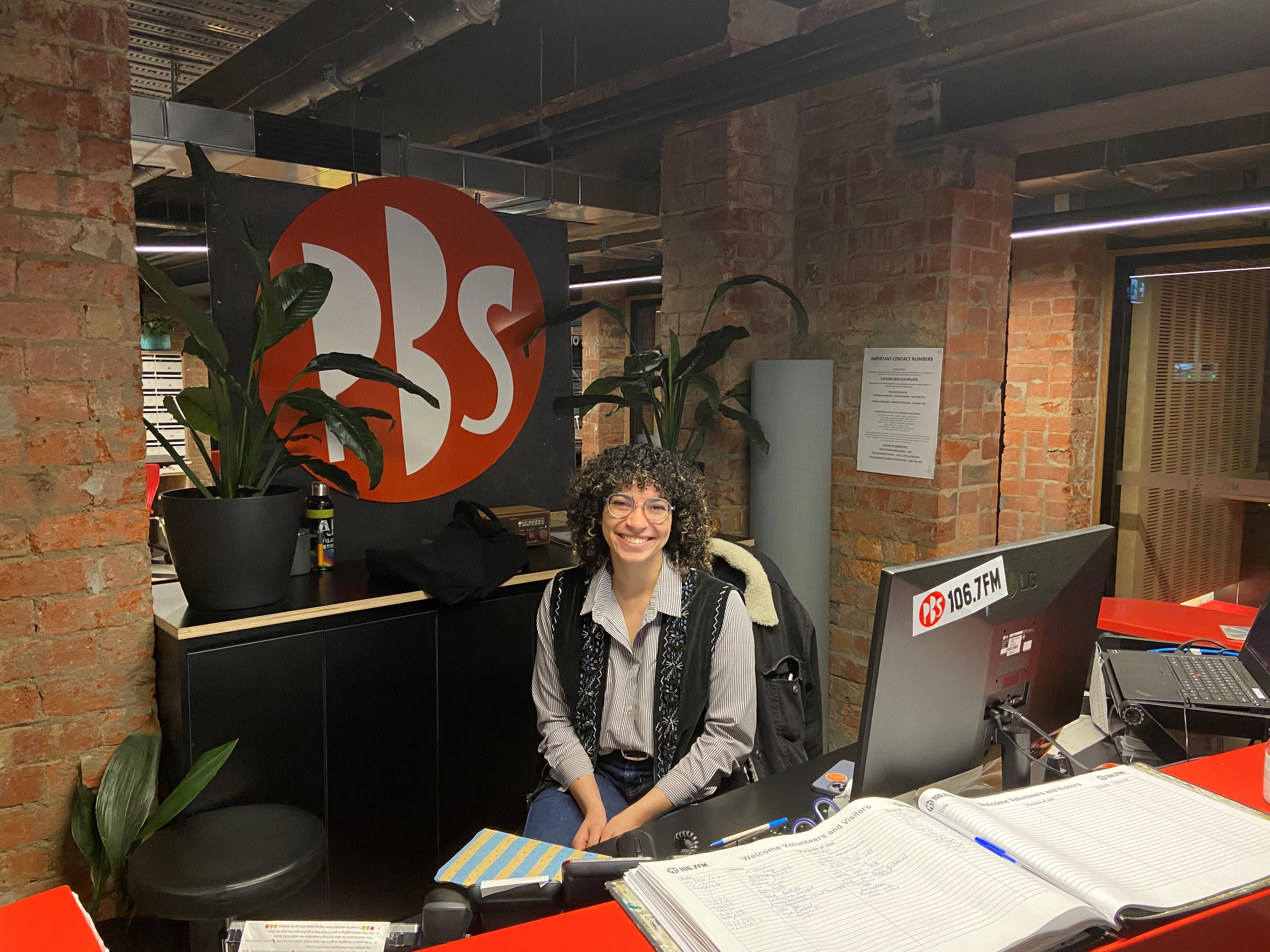 Receptionist Tyra sits at the PBS front desk